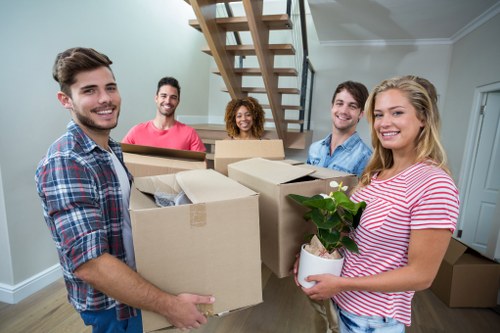 Professional movers handling household items
