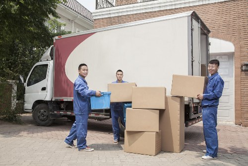 Professional movers loading a company office into a moving truck