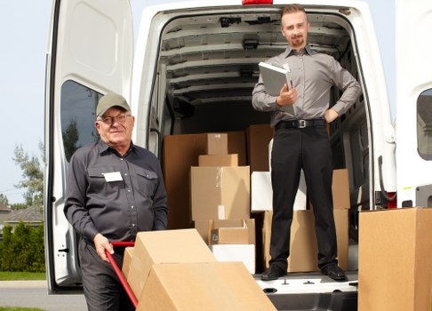 Experienced man with van team at work