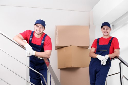 Commercial moving team handling office equipment