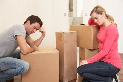 Efficient removalists handling office furniture during move